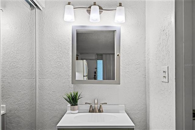 43420 Hwy 27 Unit 121, Davenport, FL 33837 - bathroom with a textured wall and vanity