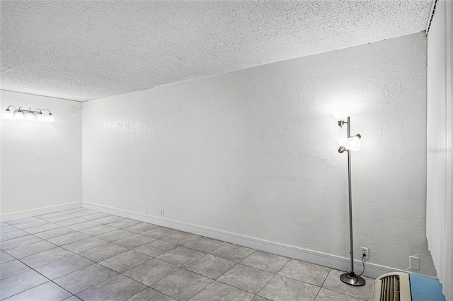 43420 Hwy 27 Unit 121, Davenport, FL 33837 - unfurnished room with a textured ceiling, tile patterned floors, a textured wall, and baseboards