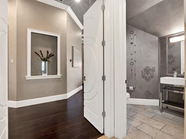971 Golden Bear Dr, Reunion, FL 34747 - bathroom featuring wood finished floors, baseboards, vanity, and toilet