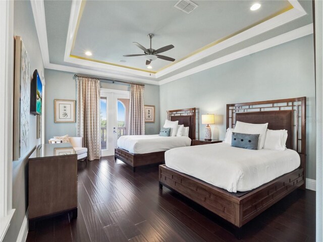 971 Golden Bear Dr, Reunion, FL 34747 - bedroom featuring french doors, a tray ceiling, access to outside, visible vents, and recessed lighting
