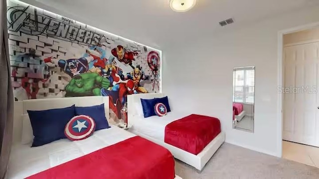 bedroom with carpet floors and visible vents