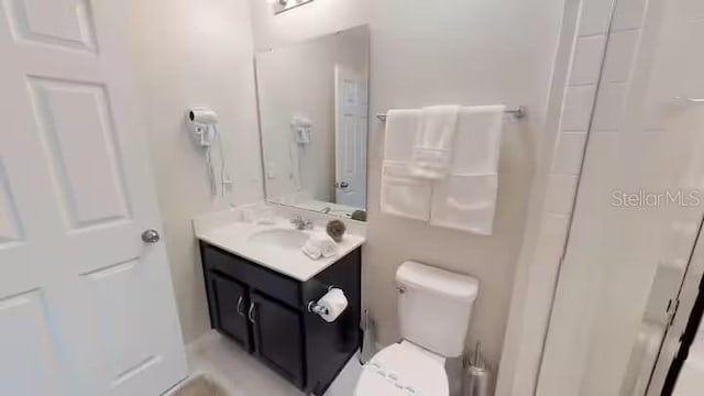 bathroom with toilet and vanity