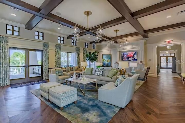 living room with beam ceiling, a wealth of natural light, a notable chandelier, and coffered ceiling
