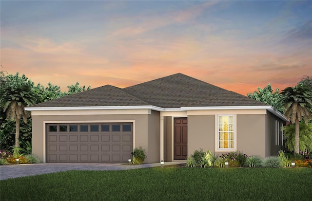 2741 Serenity Meadow Dr, Kissimmee, FL 34744 - ranch-style home featuring a garage, stucco siding, and decorative driveway