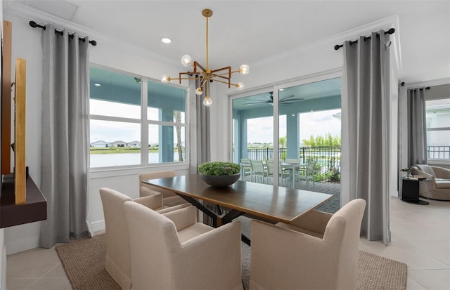 2741 Serenity Meadow Dr, Kissimmee, FL 34744 - dining room with baseboards, ornamental molding, ceiling fan with notable chandelier, and light tile patterned floors