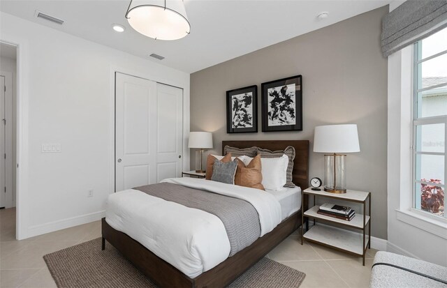 2741 Serenity Meadow Dr, Kissimmee, FL 34744 - bedroom with a closet, visible vents, and light tile patterned floors