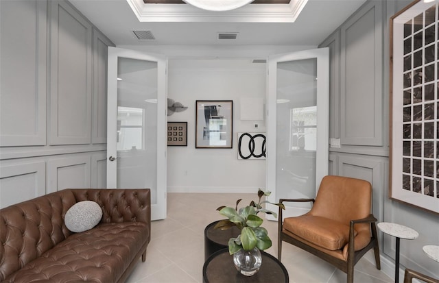 2741 Serenity Meadow Dr, Kissimmee, FL 34744 - living room featuring light tile patterned flooring, visible vents, and ornamental molding