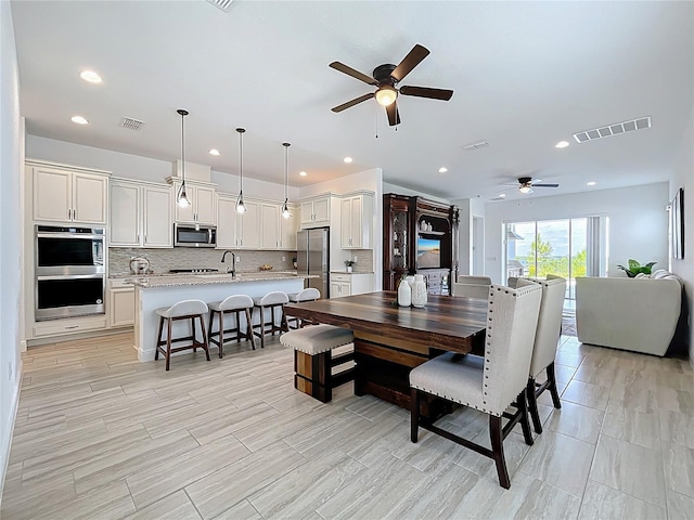 dining room with visible vents, ceiling fan, and recessed lighting