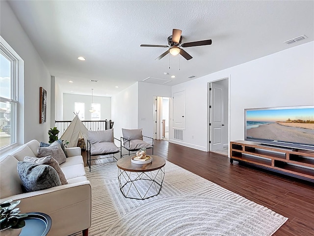 living room featuring visible vents, wood finished floors, ceiling fan, and recessed lighting