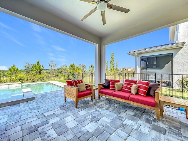 view of patio / terrace featuring outdoor lounge area, a fenced backyard, a ceiling fan, and a fenced in pool