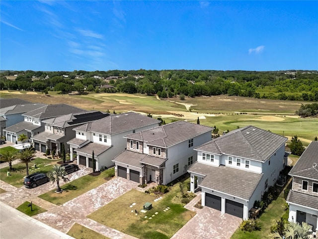 drone / aerial view featuring a residential view and view of golf course