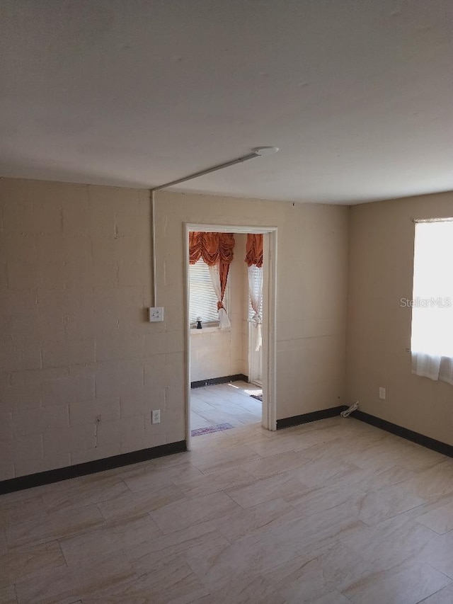empty room featuring plenty of natural light