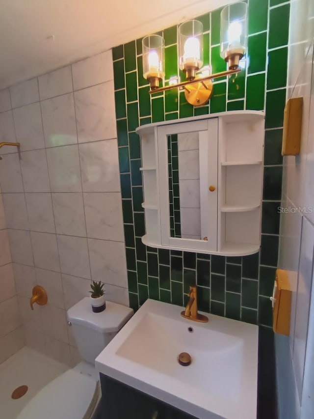 bathroom featuring toilet, vanity, tile walls, a tile shower, and backsplash
