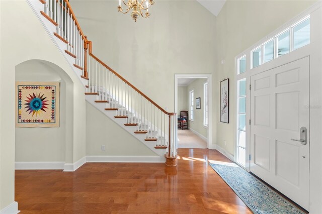 4000 Rouse Rd, Orlando, FL 32817 - foyer entrance featuring stairway, wood finished floors, and a high ceiling