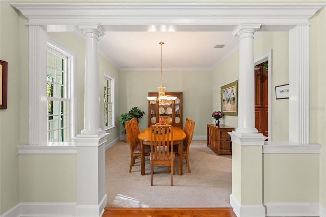 4000 Rouse Rd, Orlando, FL 32817 - dining space with ornamental molding, ornate columns, visible vents, and a chandelier