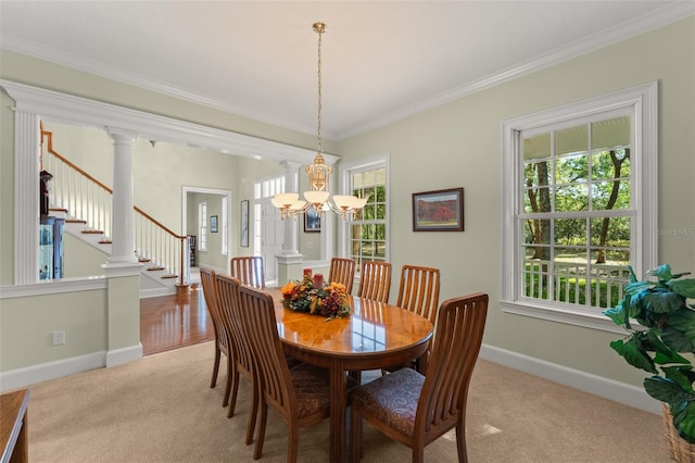 4000 Rouse Rd, Orlando, FL 32817 - carpeted dining room featuring an inviting chandelier, plenty of natural light, ornamental molding, and baseboards