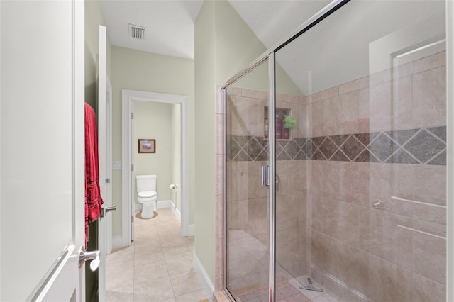4000 Rouse Rd, Orlando, FL 32817 - full bathroom with visible vents, a shower stall, toilet, and tile patterned flooring