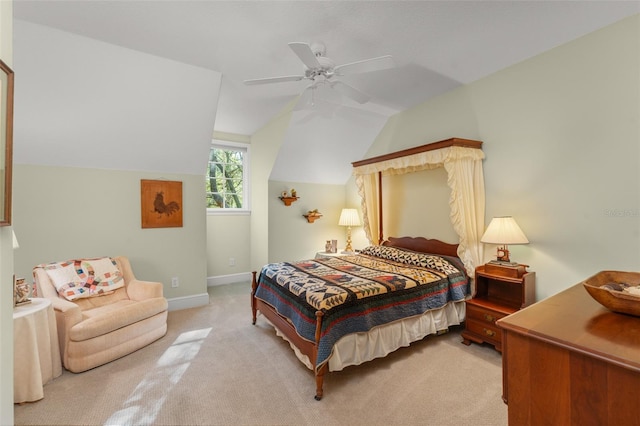 4000 Rouse Rd, Orlando, FL 32817 - bedroom with baseboards, a ceiling fan, light colored carpet, and vaulted ceiling