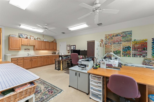 4000 Rouse Rd, Orlando, FL 32817 - office area with a sink, ceiling fan, visible vents, a textured ceiling, and light colored carpet