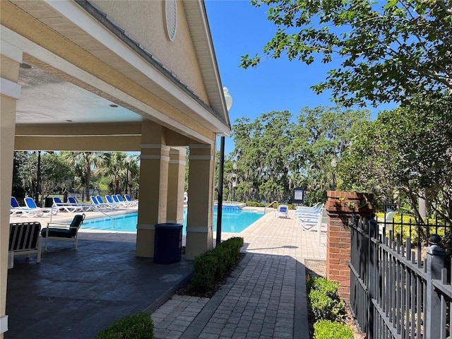 3344 Corona Village Way Unit 205, Orlando, FL 32835 - community pool featuring fence and a patio area