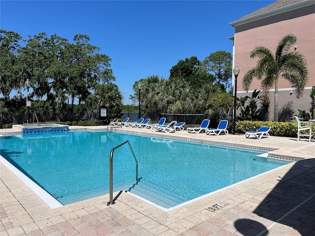 3344 Corona Village Way Unit 205, Orlando, FL 32835 - pool featuring fence, a patio area, and a hot tub