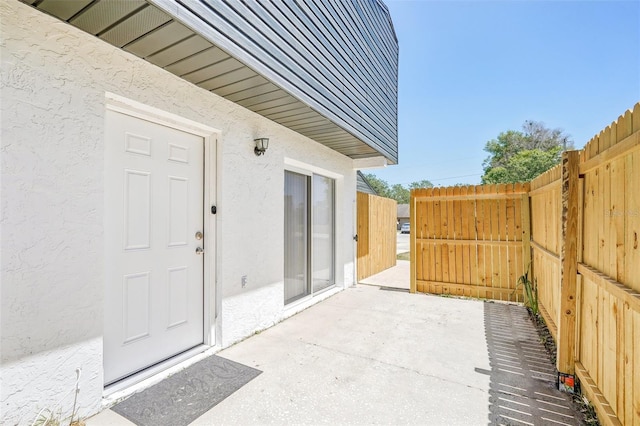 view of patio featuring fence