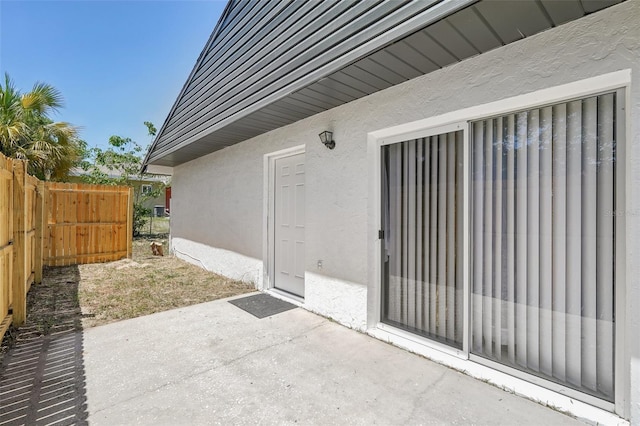 view of patio / terrace featuring fence