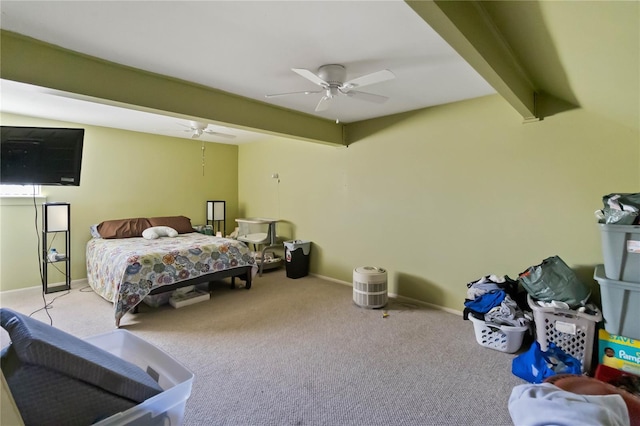 carpeted bedroom featuring baseboards, a ceiling fan, and beam ceiling