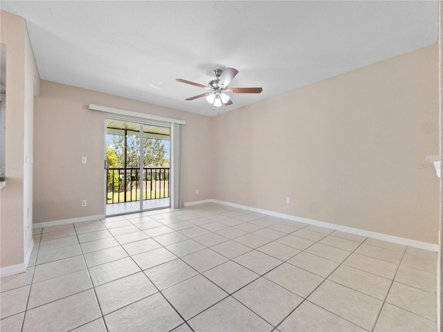 empty room featuring light tile patterned flooring, baseboards, and ceiling fan