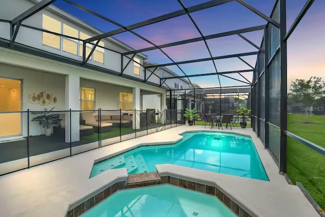 2616 Calistoga Ave, Kissimmee, FL 34741 - pool at dusk featuring a patio area and a pool with connected hot tub