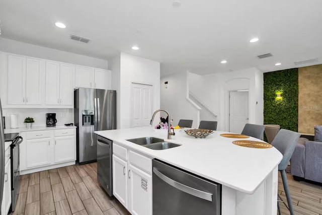 2616 Calistoga Ave, Kissimmee, FL 34741 - kitchen featuring a center island with sink, appliances with stainless steel finishes, a sink, and visible vents