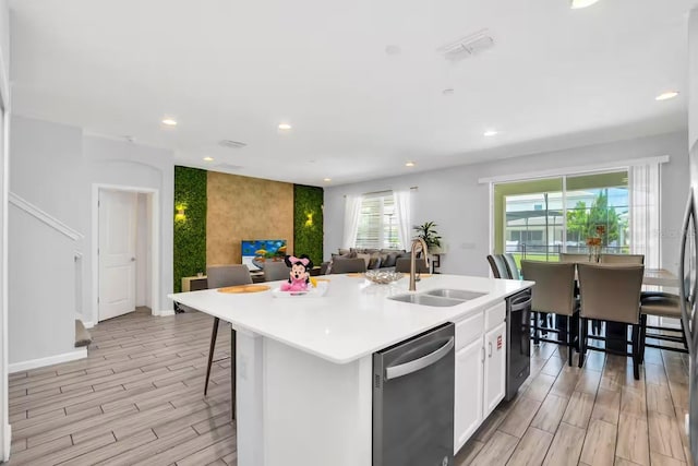 2616 Calistoga Ave, Kissimmee, FL 34741 - kitchen with recessed lighting, wood tiled floor, stainless steel dishwasher, and a sink