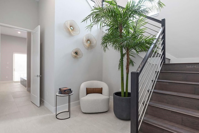 stairs featuring baseboards