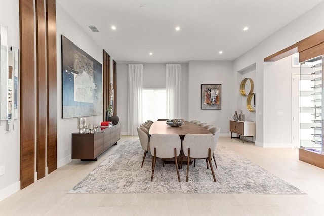dining area with recessed lighting, a wealth of natural light, baseboards, and visible vents