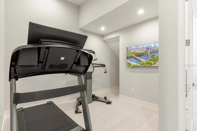 exercise area with baseboards and recessed lighting
