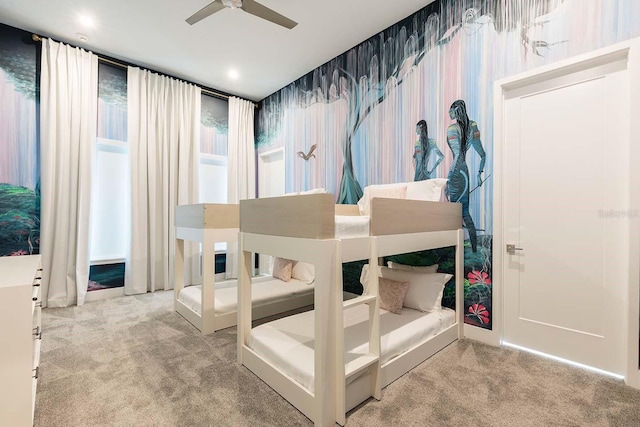bedroom with carpet floors and wallpapered walls