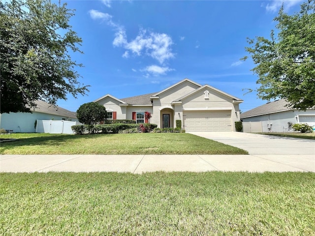 865 Bay Bridge Cir, Apopka, FL 32703 - ranch-style house featuring a garage, driveway, and stucco siding
