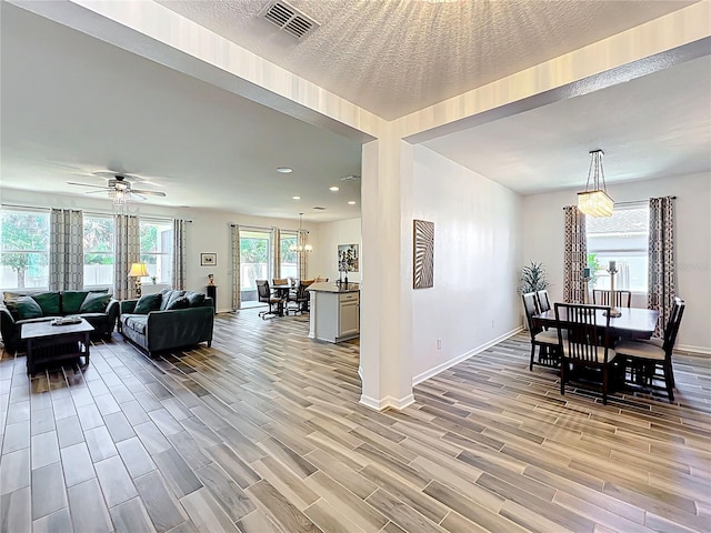 865 Bay Bridge Cir, Apopka, FL 32703 - dining space featuring light wood-style floors, baseboards, a ceiling fan, and recessed lighting