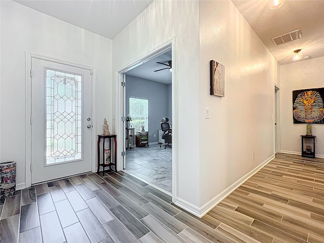 865 Bay Bridge Cir, Apopka, FL 32703 - entrance foyer with wood tiled floors, baseboards, and ceiling fan