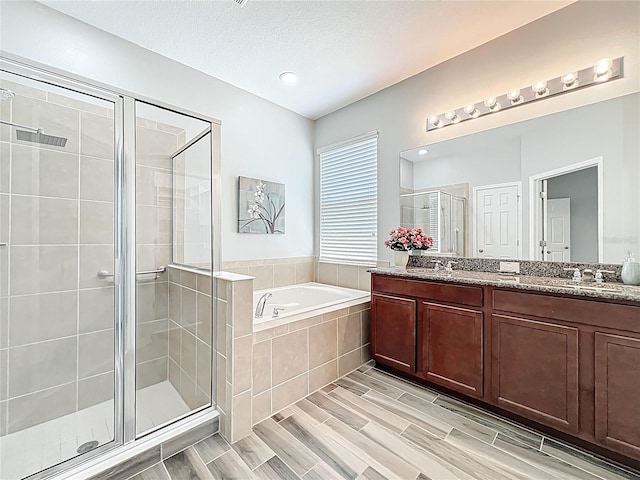 865 Bay Bridge Cir, Apopka, FL 32703 - bathroom with a shower stall, a bath, double vanity, and wood finished floors