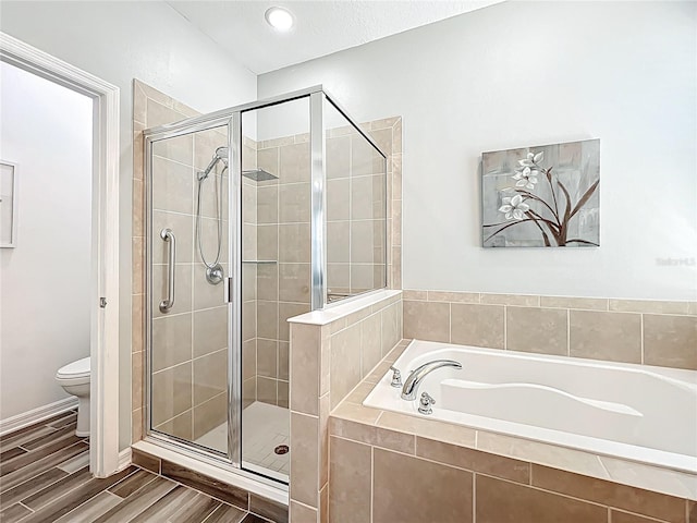 865 Bay Bridge Cir, Apopka, FL 32703 - full bathroom with a bath, a stall shower, toilet, wood finished floors, and baseboards