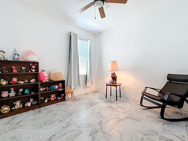 865 Bay Bridge Cir, Apopka, FL 32703 - sitting room featuring ceiling fan, baseboards, and light marble finish flooring