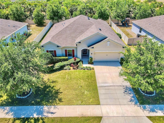 865 Bay Bridge Cir, Apopka, FL 32703 - view of front of home with concrete driveway, an attached garage, stucco siding, and a shingled roof
