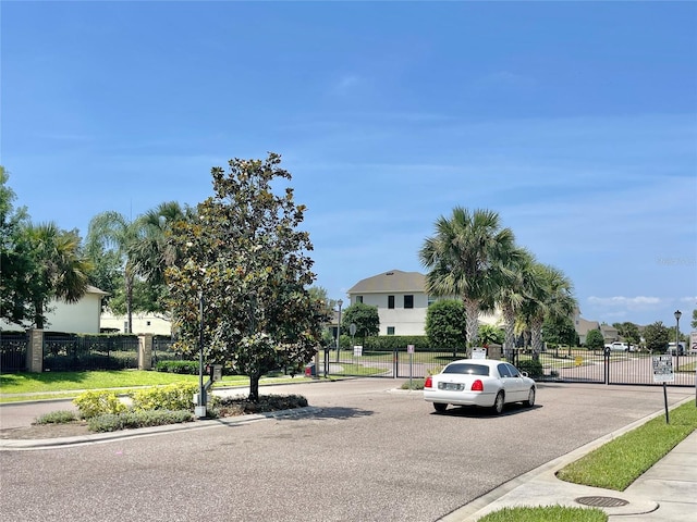 865 Bay Bridge Cir, Apopka, FL 32703 - view of asphalt road featuring a gate, curbs, sidewalks, and a gated entry