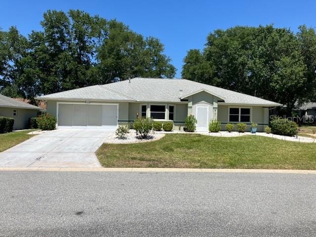 6419 Borg St, Leesburg, FL 34748 - single story home featuring concrete driveway, an attached garage, stucco siding, and a front yard