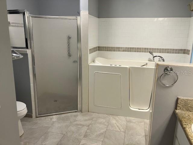 6419 Borg St, Leesburg, FL 34748 - full bathroom featuring a bath, toilet, marble finish floor, a shower stall, and vanity