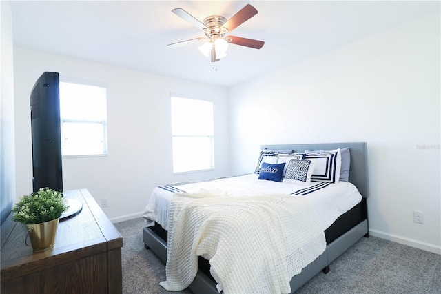 carpeted bedroom with baseboards and ceiling fan
