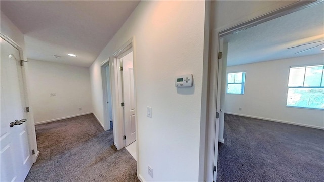 corridor with recessed lighting, baseboards, and carpet