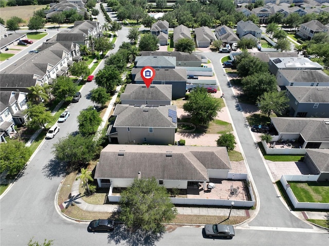 birds eye view of property with a residential view
