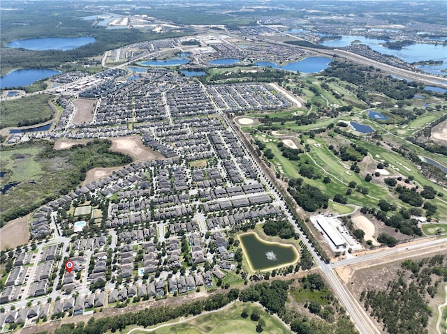 bird's eye view with a residential view and a water view